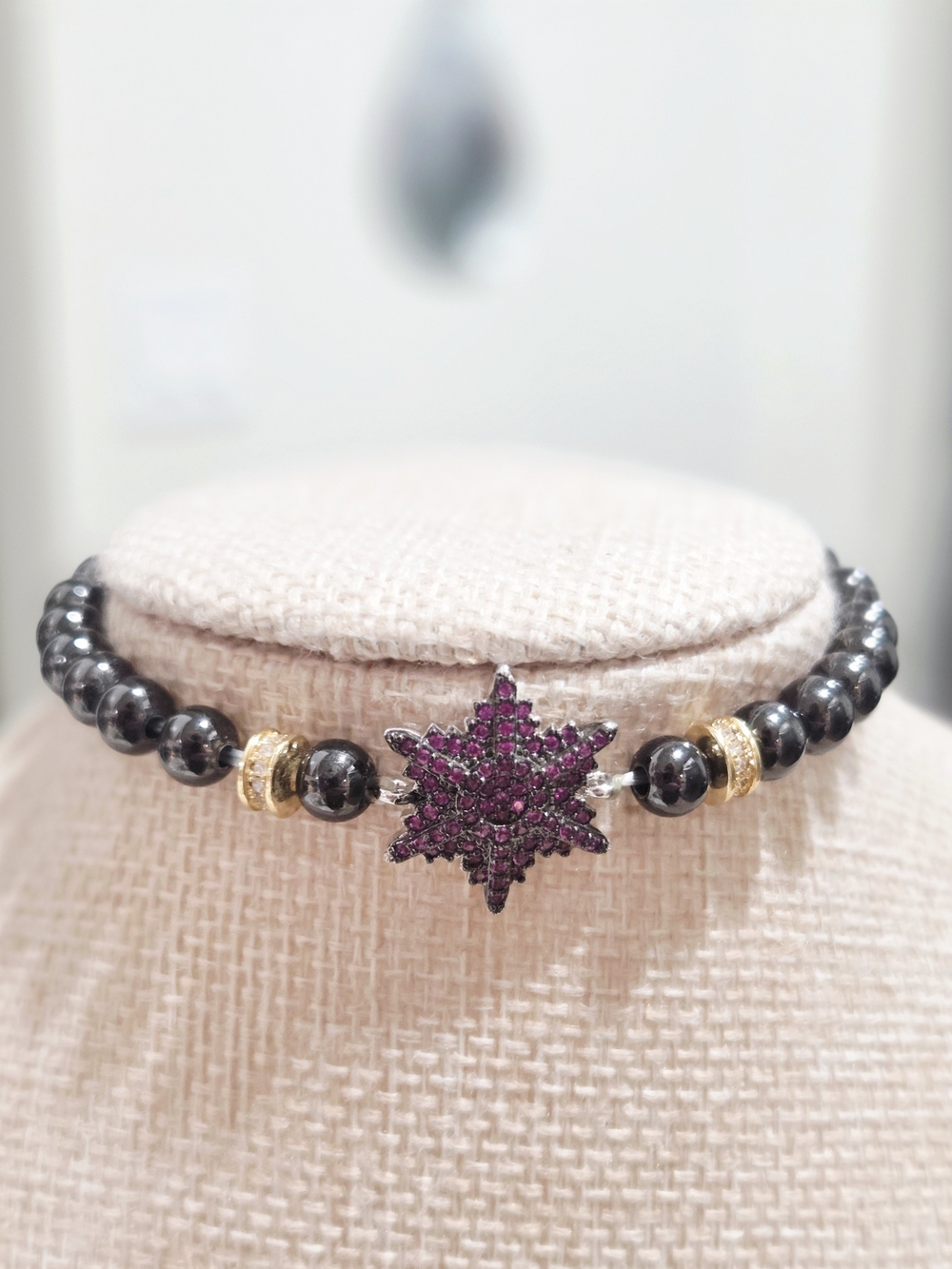 Hematite Beaded Bracelet with Purple Starburst Pendant